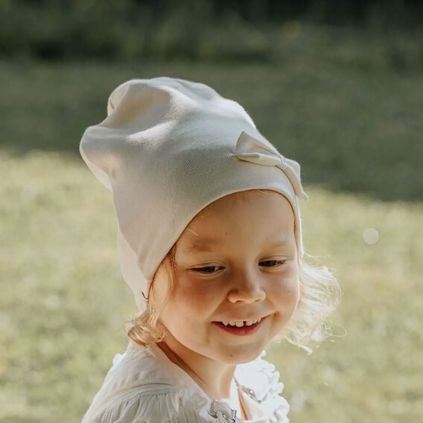 Racing Kids Tophue Windproof 2-lags Sløjfe Eggshell